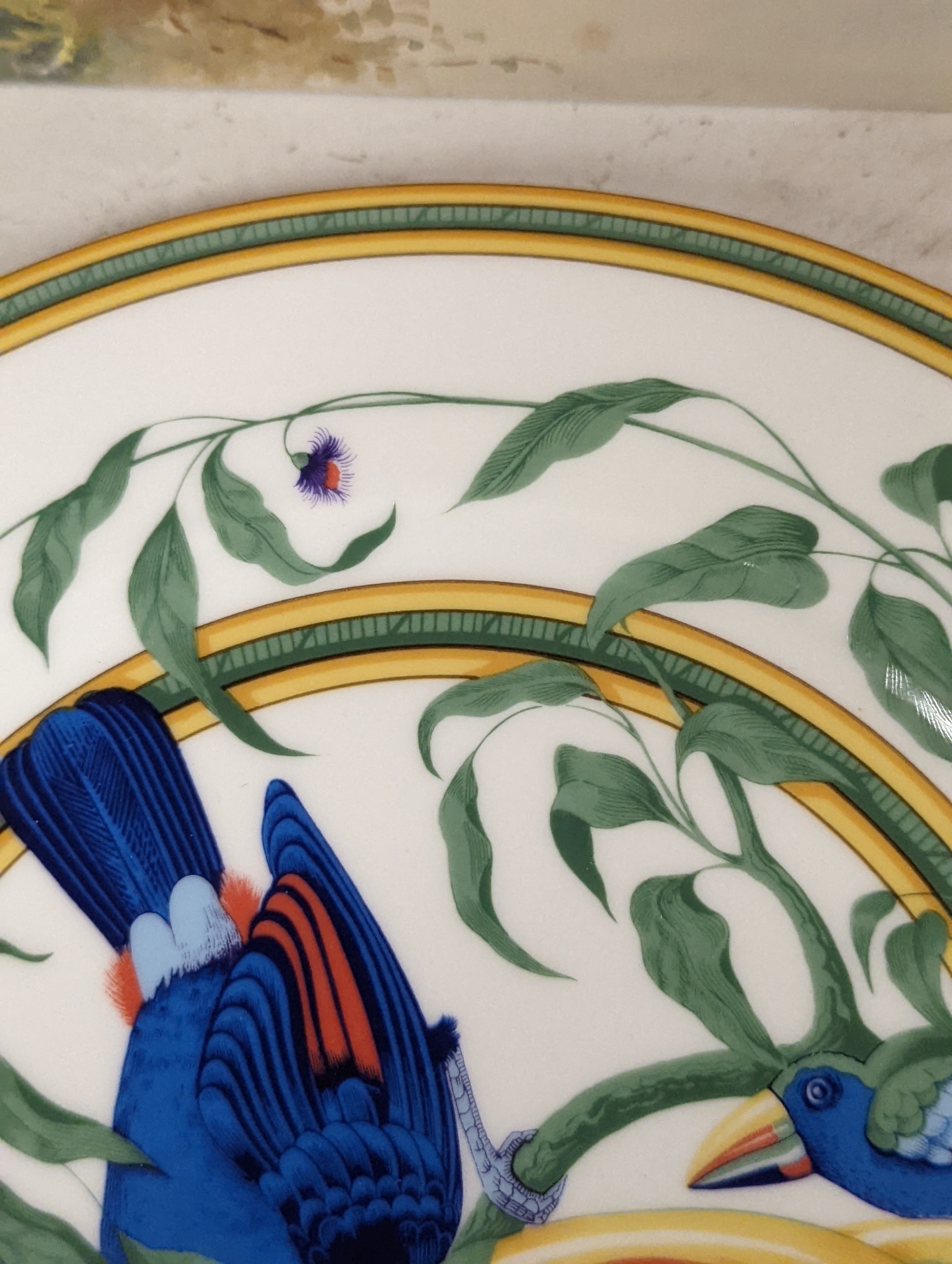 A pair of Hermes, Paris 'Toucan' plates, diameter 27.5cm, edge blemishes